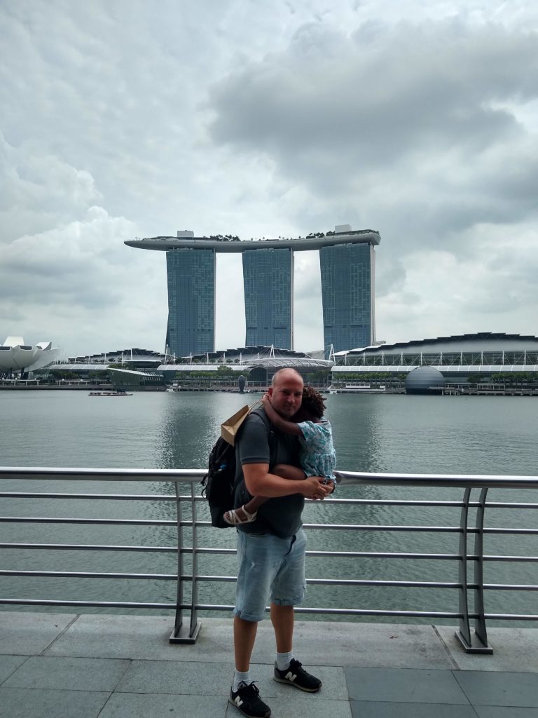 Man holing toddler daughter.