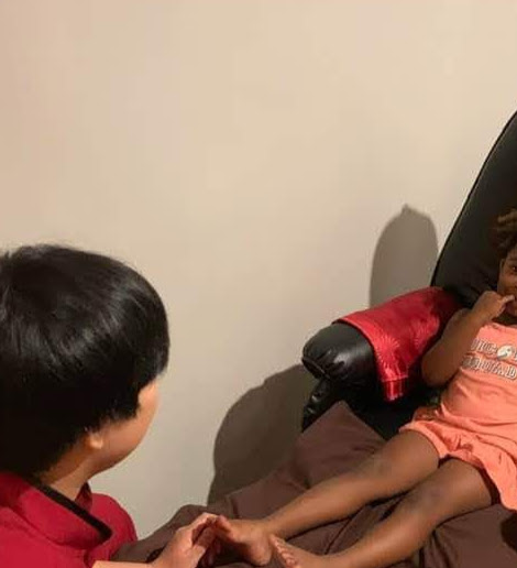 Little girl getting foot massage.